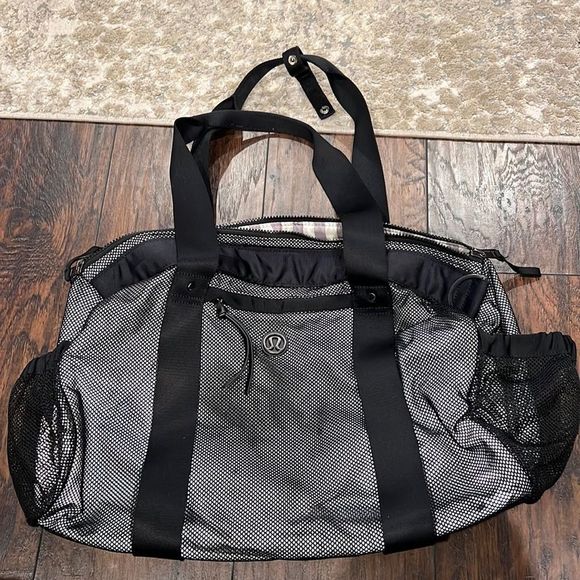 lululemon athletica Handbags - LULULEMON big duffle bag reflective awesome gum running bag has flaws GUC